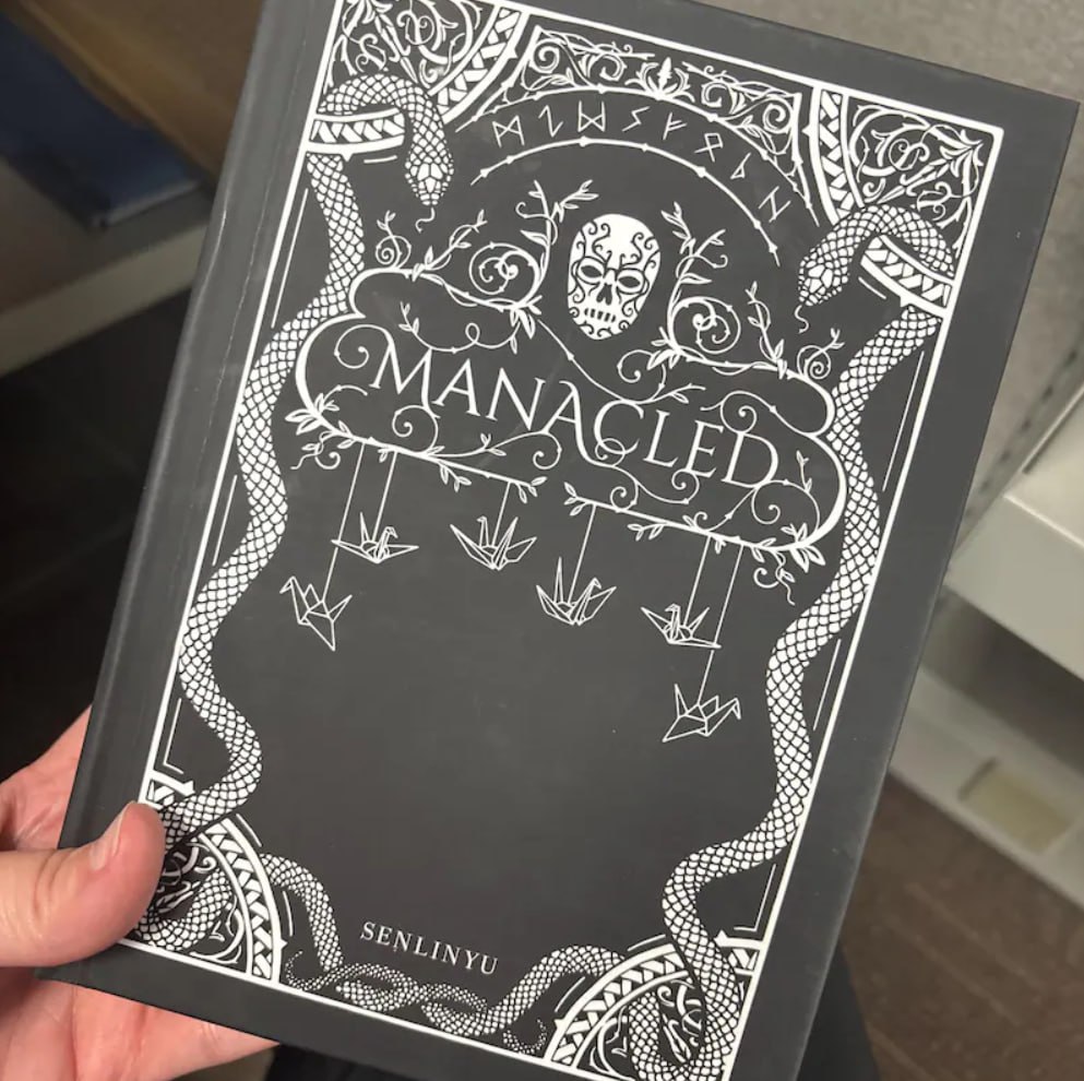 Manacled book set side view